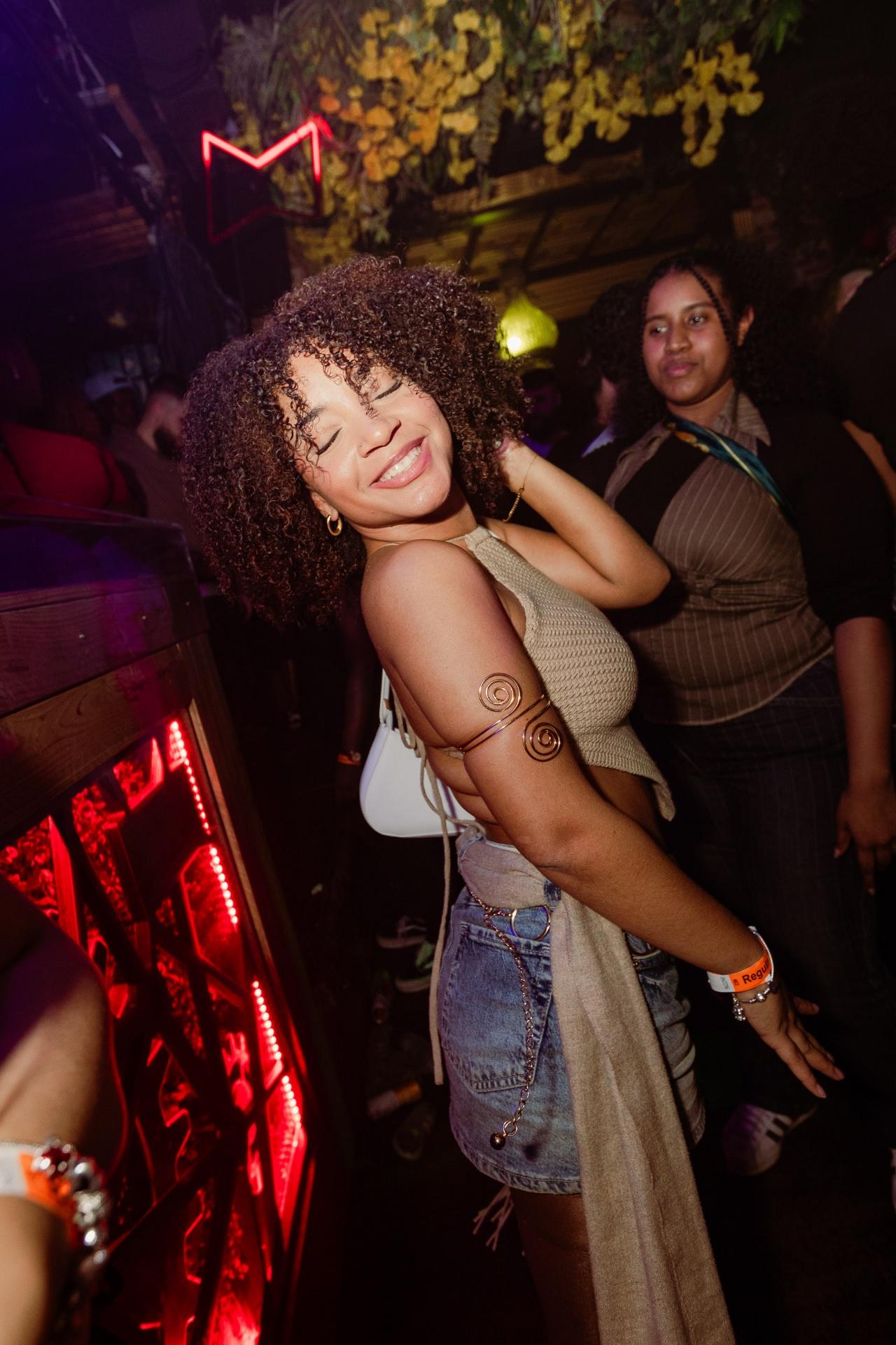 Girl dancing at AfroGasm Afrobeats party in Breda